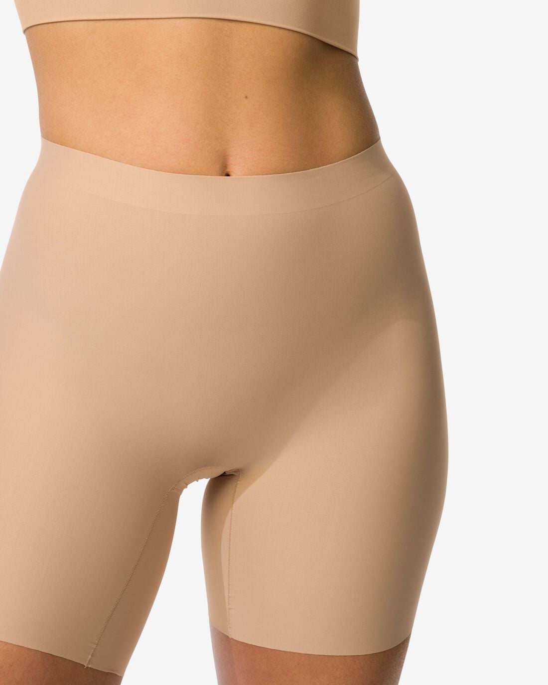HEMA Medium corrigerende biker hoge taille beige (beige) | HEMA